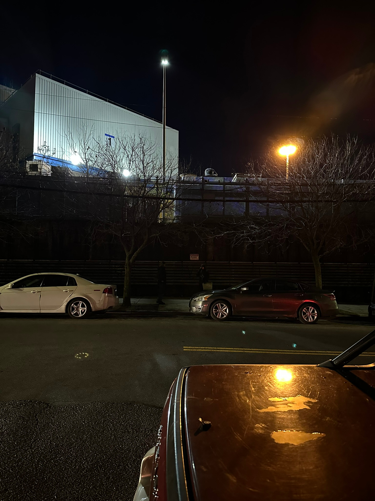 Glare from unshielded streetlight, pedestrian not visible