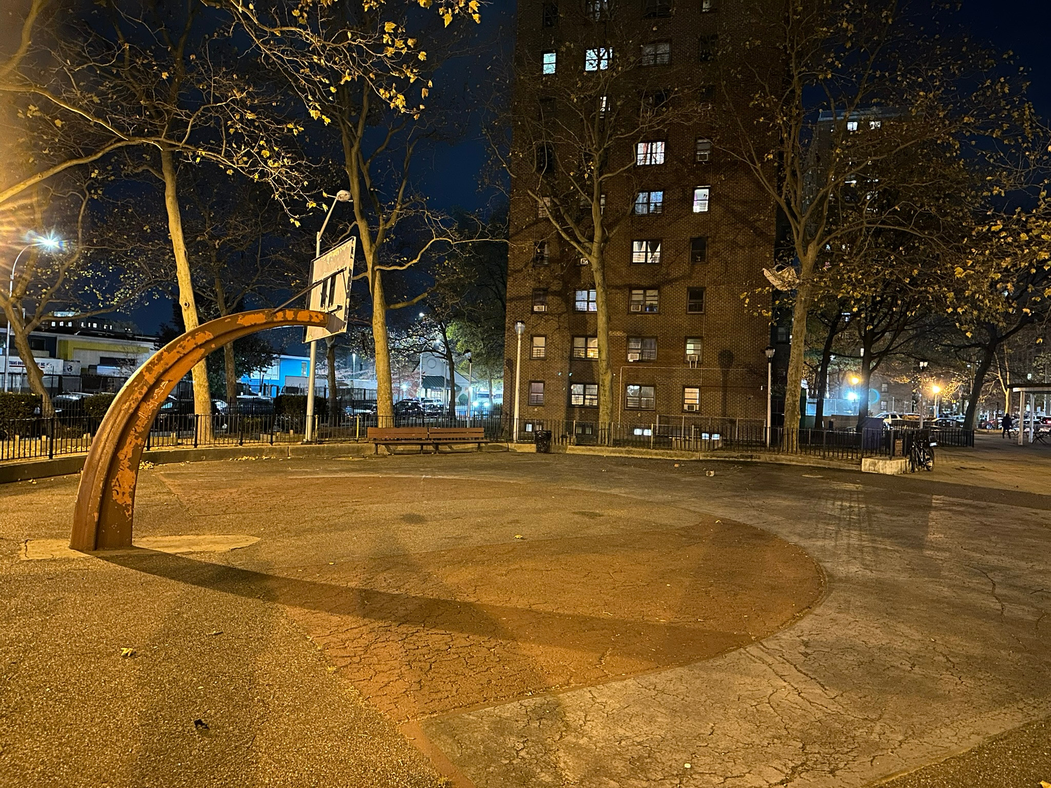 Poorly lit basketball court at NYCHA Seth Low